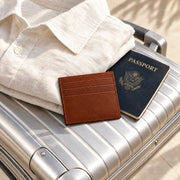 Brown ALTAIR cardholder resting on an ALTAIR aluminium suitcase